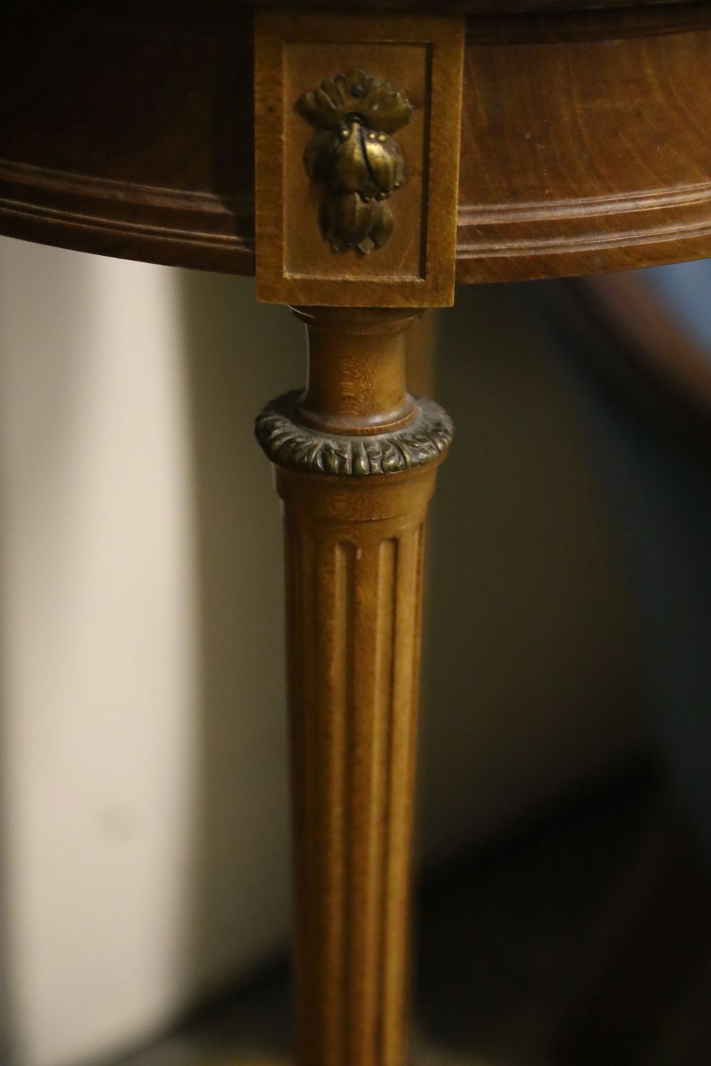 A Haentges Freres, Paris, circular marble top two tier table, diameter 47cm, height 84cm